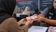 Ilustrasi dibat dari AI menggambarkan korban investasi bodong dikembalikan asetnya. (Kredit Foto: Istimewa)
